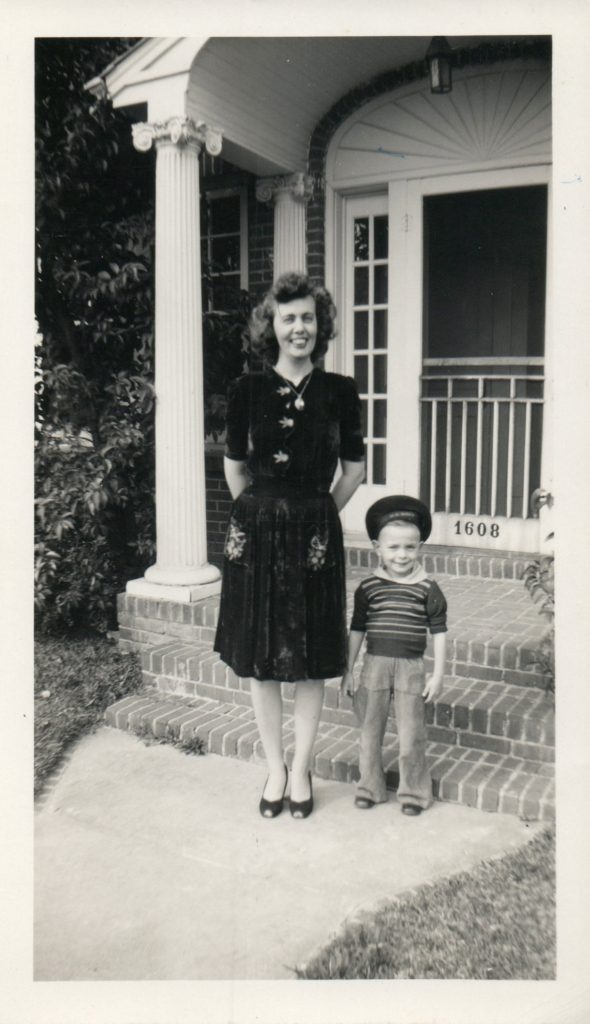 Black and white photo of Larry and his mother Flo on porch in 1944